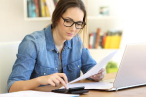 Woman working on a laptop.