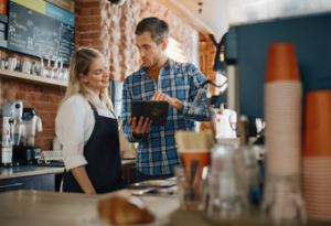 A restaurant employee talking with her boss.
