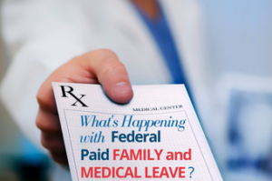 Employer handing an employee a note that says "What’s Happening with Federal Paid Family and Medical Leave?"