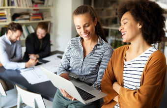 Two women dicussing employee performance and engagement