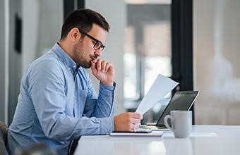 Man working on ownership information.