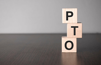 """PTO"" spelled out on blocks."