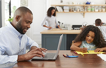 Man working from home with his family.