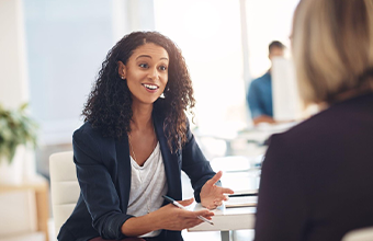 Two women discussing HR.