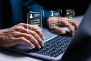 Manager using laptop with virtual HR icon