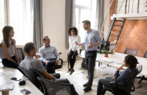Leader Talking With Group of Co-Workers
