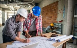 Construction Managers Reviewing Paperwork