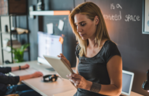 Woman scheduling on digital tablet