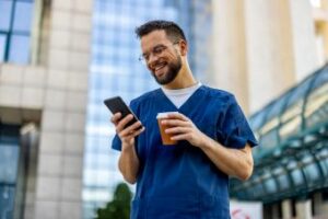 Hospital worker using smart phone app