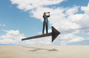 Businesswoman standing on a floating arrow looking through a telescope