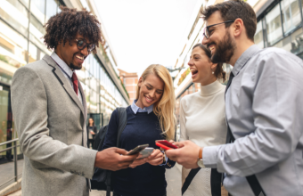Business professionals talking and sharing contact info on their phones
