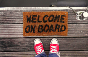 Welcome mat with red sneakers 