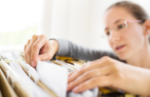 snooping employee files in file cabinet