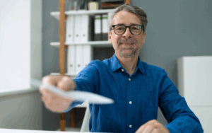 Handing over a paycheck to employee
