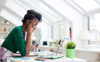 Woman focusing on her screen to accomplish tasks at work