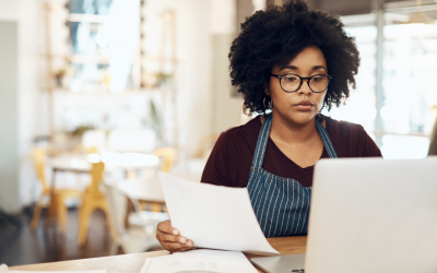 Restaurant manager working on her computer on payroll