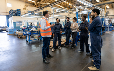 Manager speaking to factory employees.