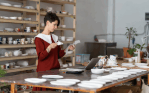 Woman looking through receipts for an expense report.