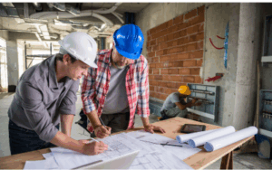 Construction Managers Reviewing Paperwork