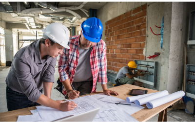 Construction Managers Reviewing Paperwork