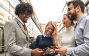 Business professionals talking and sharing contact info on their phones