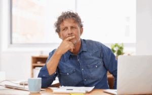 Man working on ownership information.