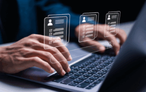 Manager using laptop with virtual HR icon