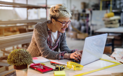 Woman working on her laptop in her studio