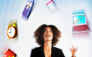 Woman juggling scheduling technology items