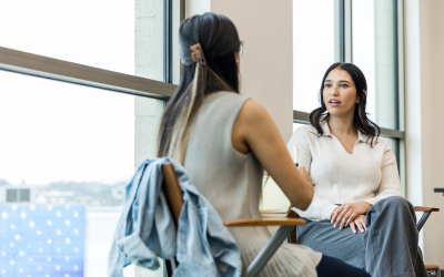 Two women discussing performance review
