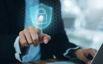 An executive pointing at a digital lock to protect his company's data from cyber attacks
