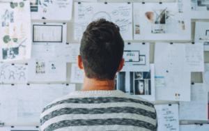 Man studying idea board for brainstorming