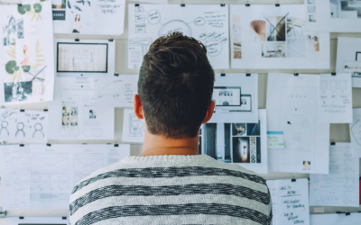Man studying idea board for brainstorming