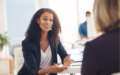Two women discussing HR.