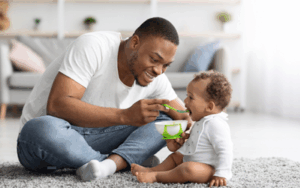 Dad caring for toddler, Paid Family Medical Leave
