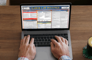labor law posters on laptop