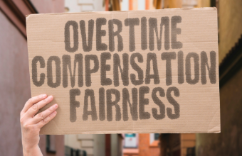 Employment law sign about fairness and compensation