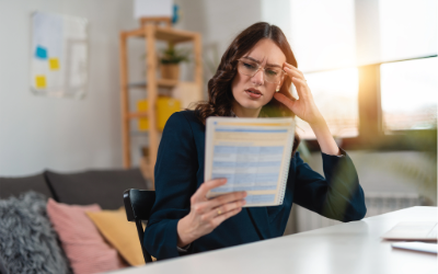 Woman reading paperwork perplexed