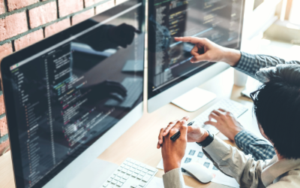 employees solving problem on computer