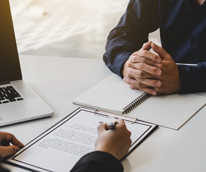 Manager reviewing workplace rules with new employee