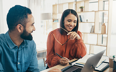Man and woman looking at laptop