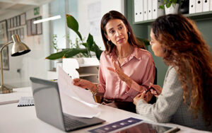 Office, planning and financial advisor with client for document, investment discussion and tips. Business meeting, women or conversation with policy for insurance advice, guidance or corporate report