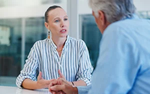 Man and woman having a business discussion in an office