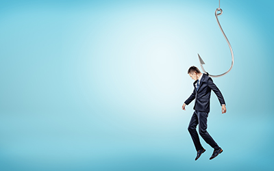 A tiny businessman hanging from a giant silver fishing hook like a puppet doll. Tight business rules. Unfree market. Corporate regulations.